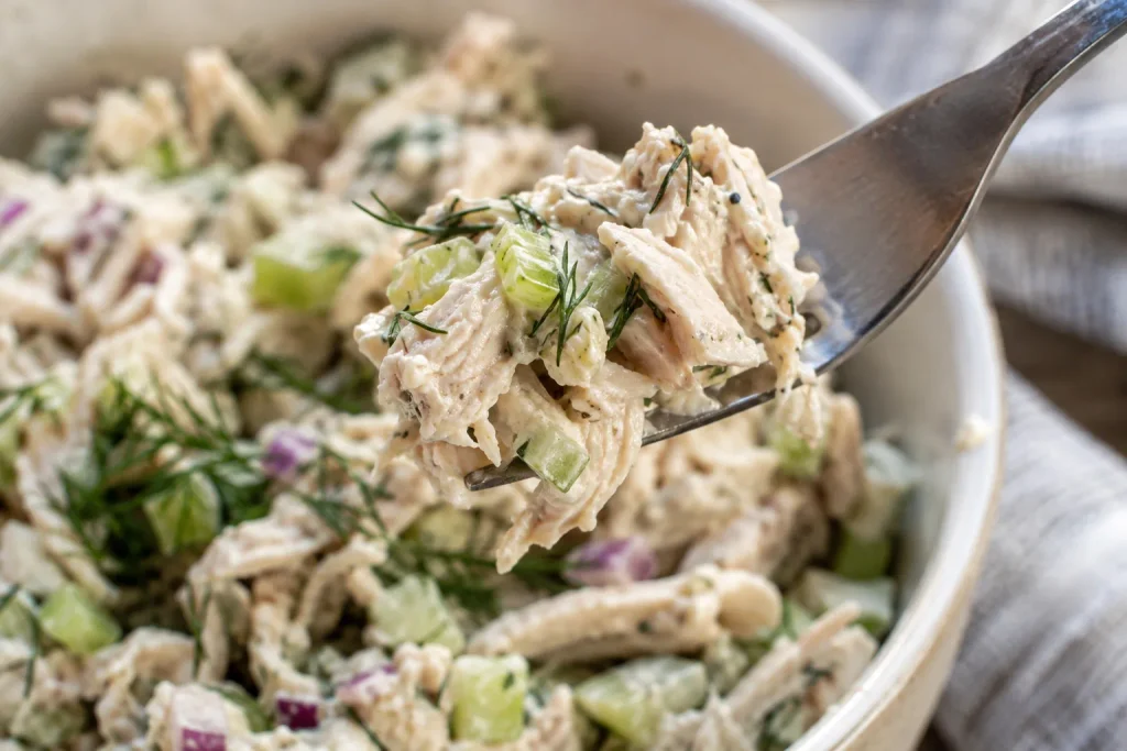 Chicken Salad Recipe: A Creamy Classic Made with 7 Ingredients 7 Close-up bite of creamy chicken salad recipe on a fork