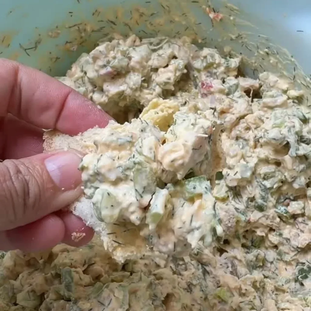 Chicken Salad Recipe: A Creamy Classic Made with 7 Ingredients 2 Creamy chicken salad with celery and fresh dill served on a slice of bread