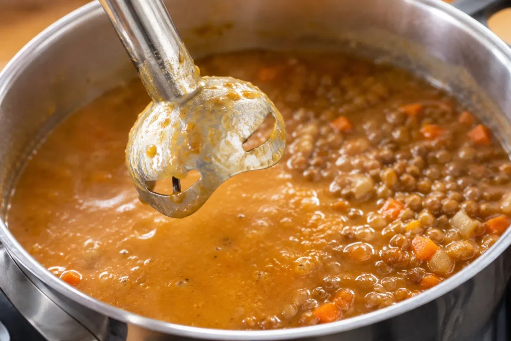 Immersion blender showing the smooth and whole lentil texture contrast
