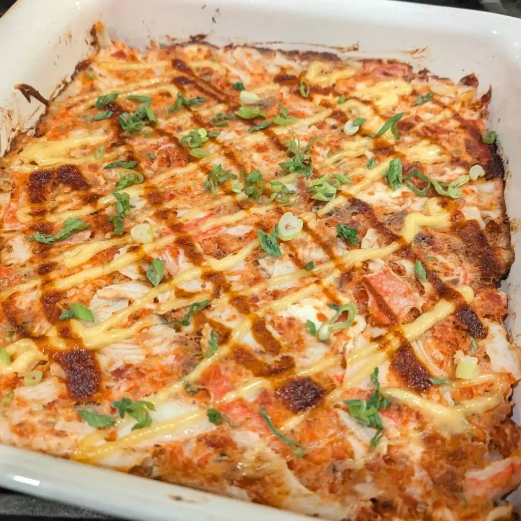 Sushi Bake Recipe: Creamy, 8 Ingredients, and No Rolling Required 2 Spicy crab sushi bake casserole topped with creamy mayo drizzle and sliced green onions
